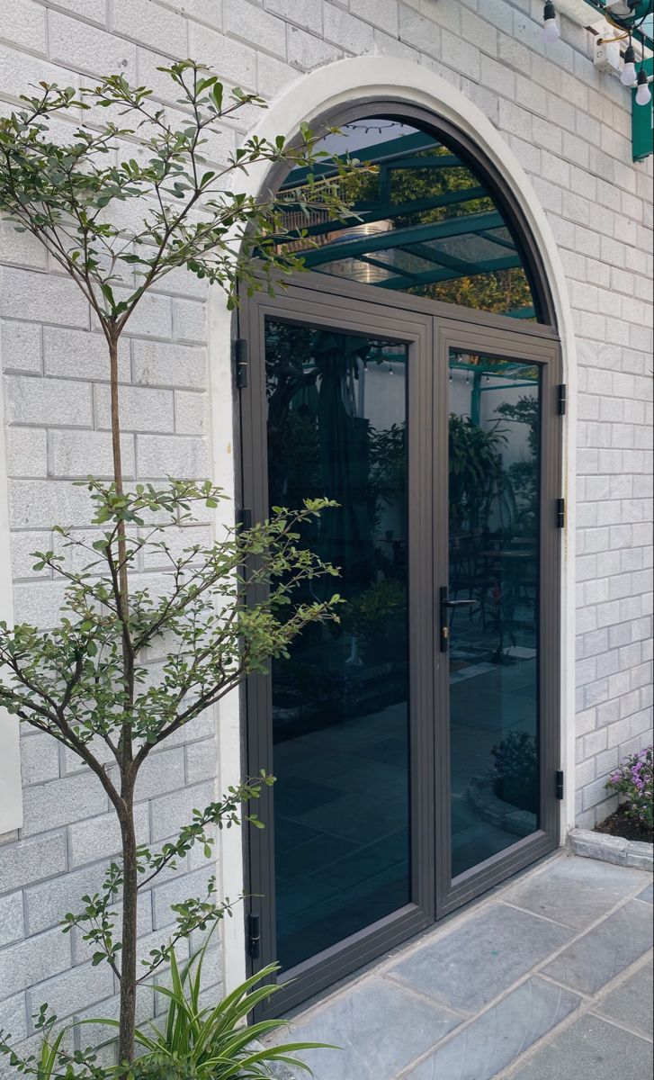 cửa đi uốn vòm nhôm Xingfa